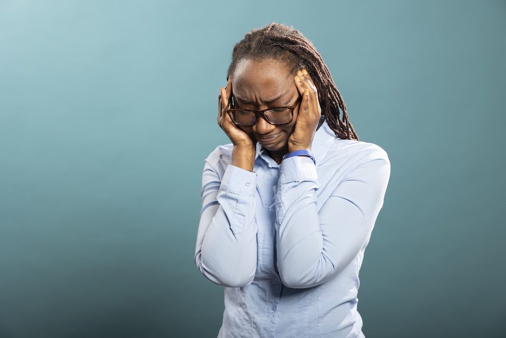 a woman having a migraine
